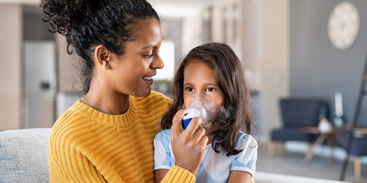 child receiving asthma treatment