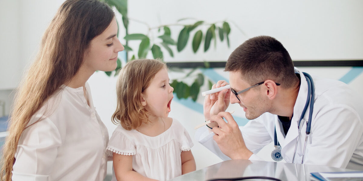 pediatrician performing a well child visit